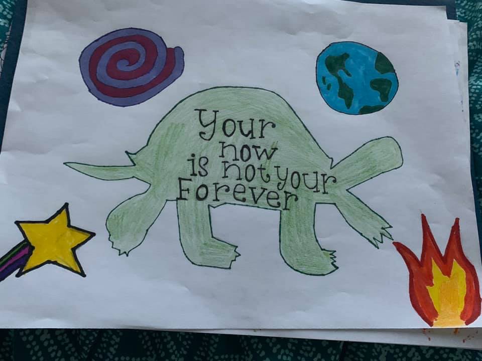 drawing of a turtle with text on it "your now is not your forever," surrounded by drawings of a spiral, Earth, a star, and flames